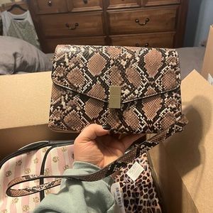 I am selling a snake skin looking purse